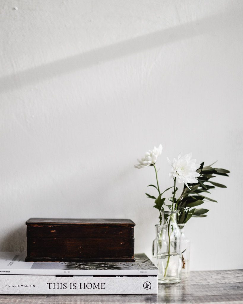 still life of flowers and books