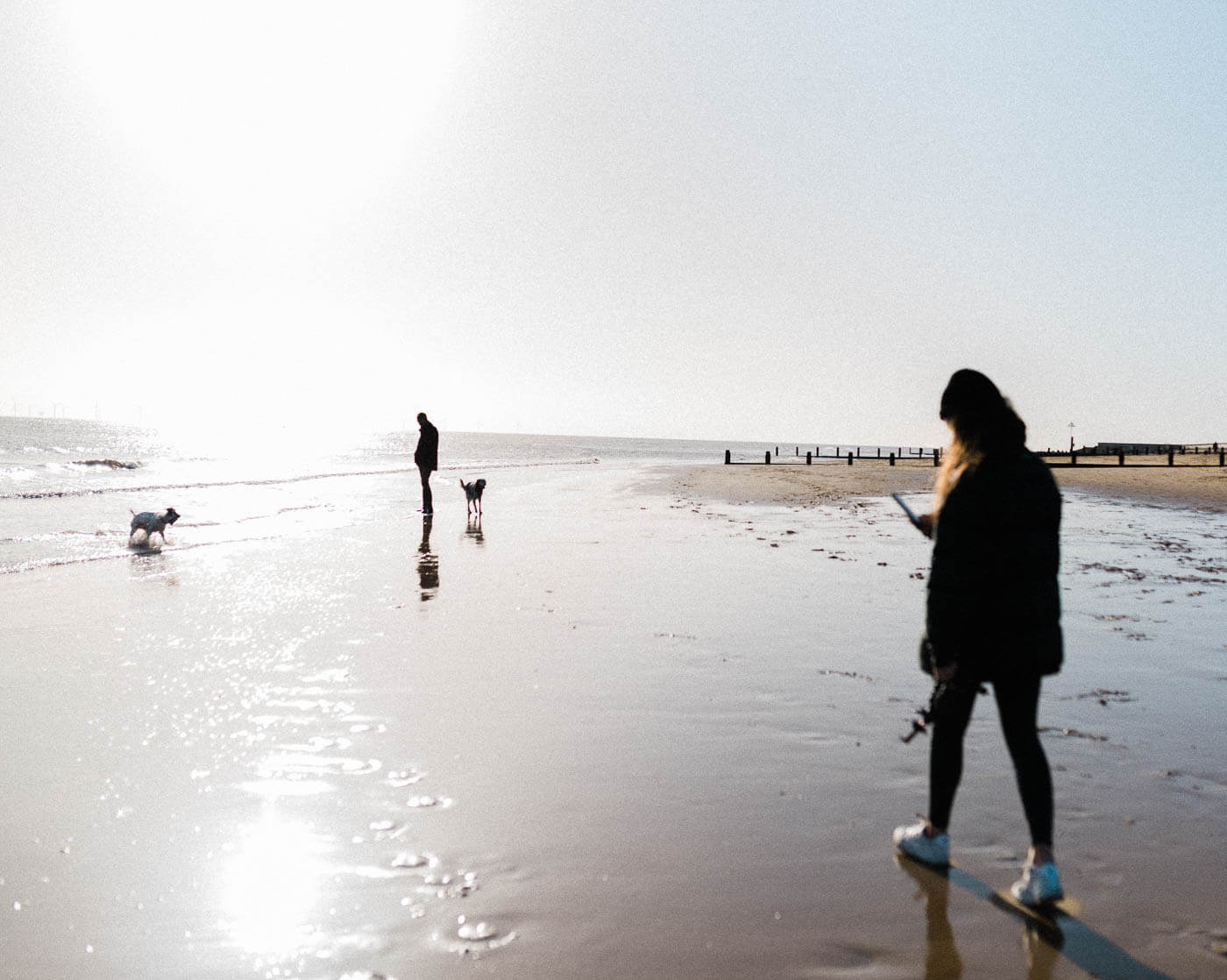 family walking on beach at Frinton-On-Sea